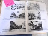 an open book with pictures of people and buildings on it