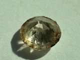 an image of a rough diamond on a white surface