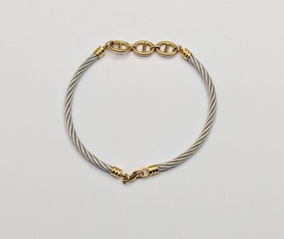 a gold and silver cable bracelet with a clasp