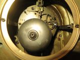 a close up view of a clock with a metal ball