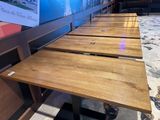 a lot of tables that are lined up in a row