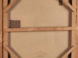 an old picture of a wooden frame with a picture in it