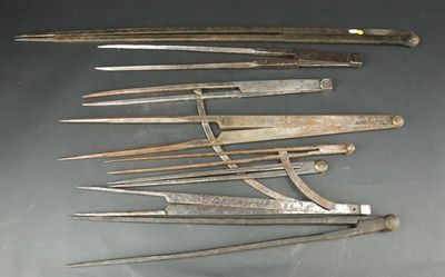 a lot of old tools that are laying on a table
