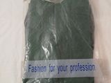 a plastic bag with a green t - shirt in it