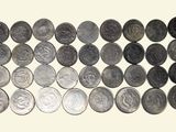 an image of a pile of coins sitting on top of a white surface
