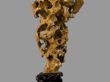 an image of a sculpture of a piece of wood on a stand