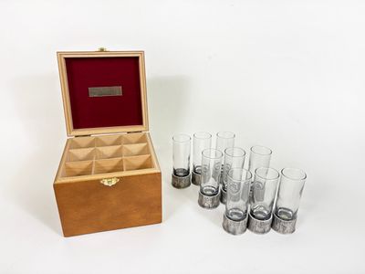a wooden box with six glasses in it and a box with six glasses in it