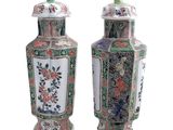 pair of chinese vases with flowers and birds painted on them