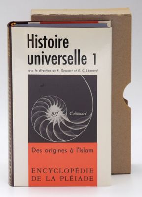 an image of a book sitting on top of a table next to a box of books