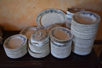 a lot of plates and bowls on a table