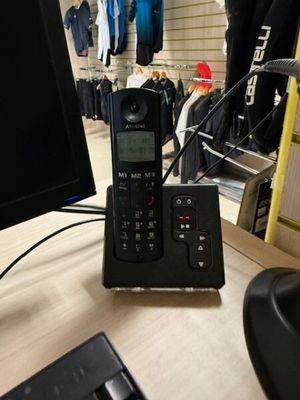 an image of a phone and a computer monitor on a desk