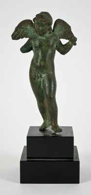an image of a bronze statue of an angel on a black pedestal