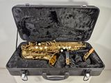 a saxophone in a case that is sitting on a table