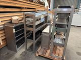 a metal shelf with several shelves on it in a warehouse