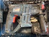 a cordless drill and a cordless hammer in the back of a truck