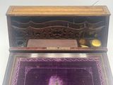 an old fashioned desk with a purple rug on it
