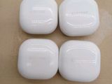 three white soap bars sitting on top of a table next to each other