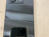 the back of a black phone with a camera attached to it
