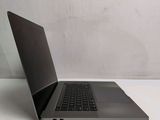 a laptop that is sitting on a white table