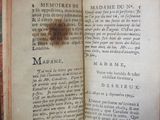 a book open on a table with writing on it