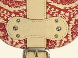 a close up of a purse with a strap on it