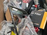 a cardboard box filled with assorted electronics and other items