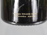 a close up of a black oil filter on a white background