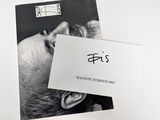 a black and white photo of a man with a business card on his head