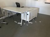 an image of an empty office with a desk and chairs