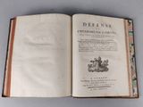 an open book with a picture of a castle on it