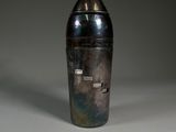 an image of a silver vase sitting on top of a table