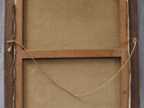 an old wooden frame with a rope hanging from it