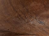 a close up of a wooden statue of a person