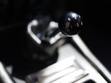 a close up of a car ' s gear lever and shift knob