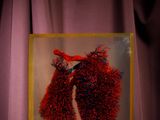 an image of a red heart in a clear box on a table