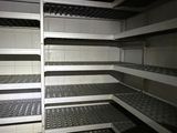 a large open refrigerator with many shelves in it