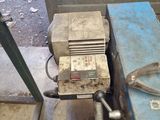 a machine that is sitting on the ground next to a wall