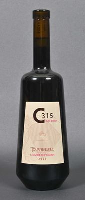 a bottle of wine that is sitting on a table