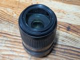 a camera lens sitting on top of a wooden table