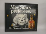 a picture of a marilyn monroe advertisement on the wall