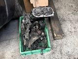 a box full of assorted parts sitting on the floor