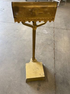 a sign that is on top of a metal stand