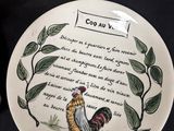 a plate with a rooster on it and a plate with a poem on it