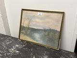 une photo d'un tableau posé sur une table près d'un mur