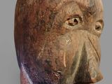 an image of a clay mask with horns on it ' s head