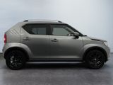a picture of a silver suv parked in a garage