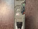 a picture of a remote control sitting on top of a wooden table