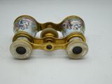 an image of a pair of binoculars sitting on top of a table