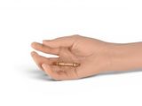 a hand that is holding a bullet in it ' s palm