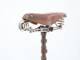 a bike seat that has a bunch of tools attached to it